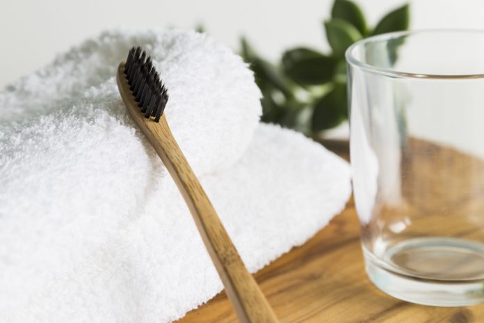 Bamboo toothbrush with towel and glass